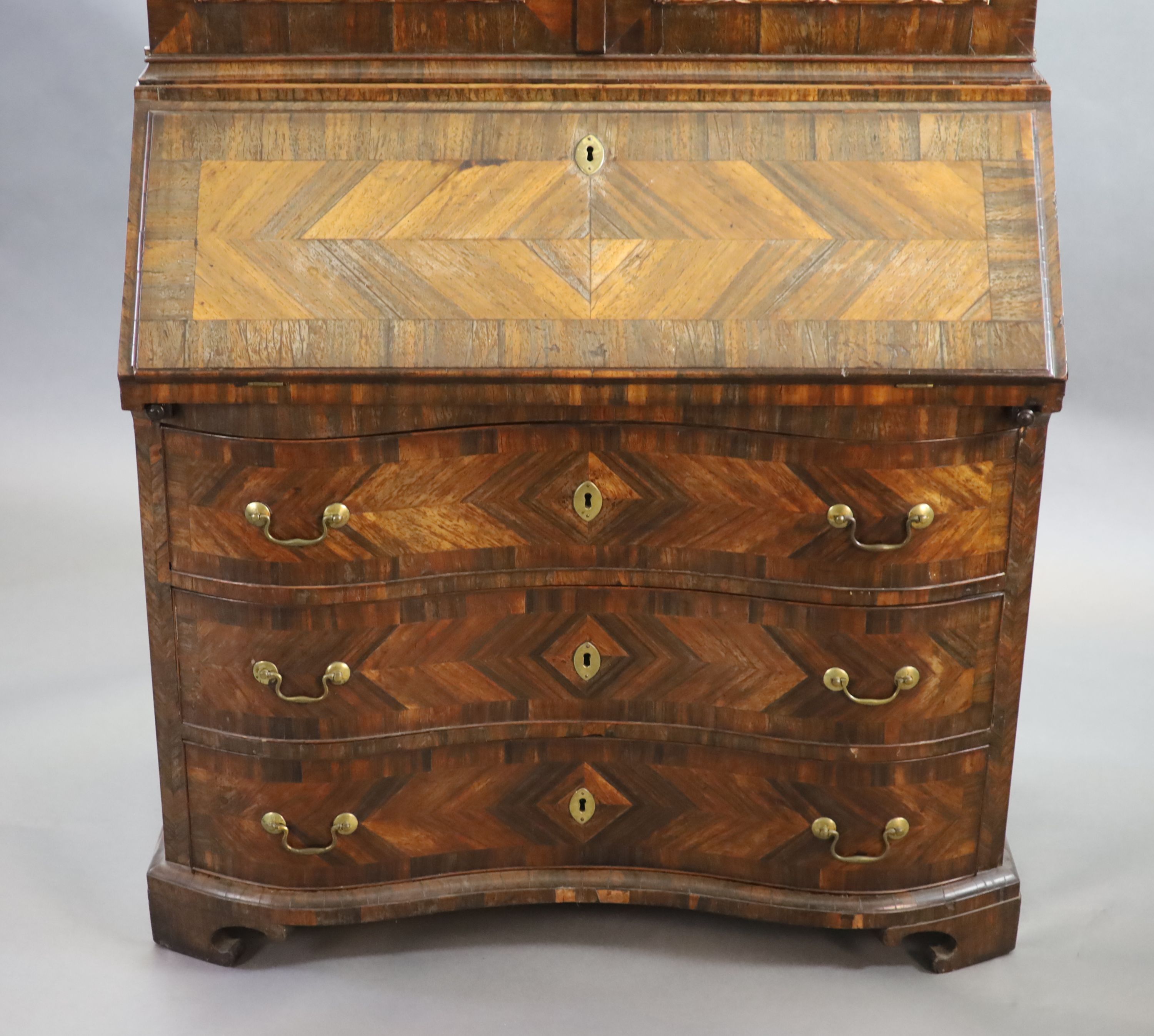 A mid 18th century Italian rosewood parquetry and parquetry bureau bookcase, W.107cm D.57cm H.237cm.